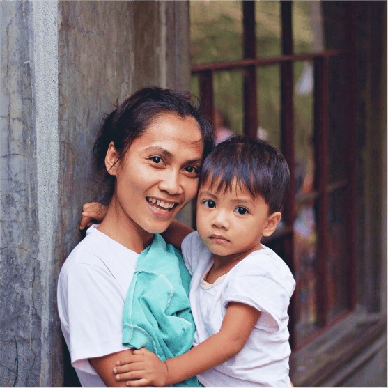 A girl holding a child